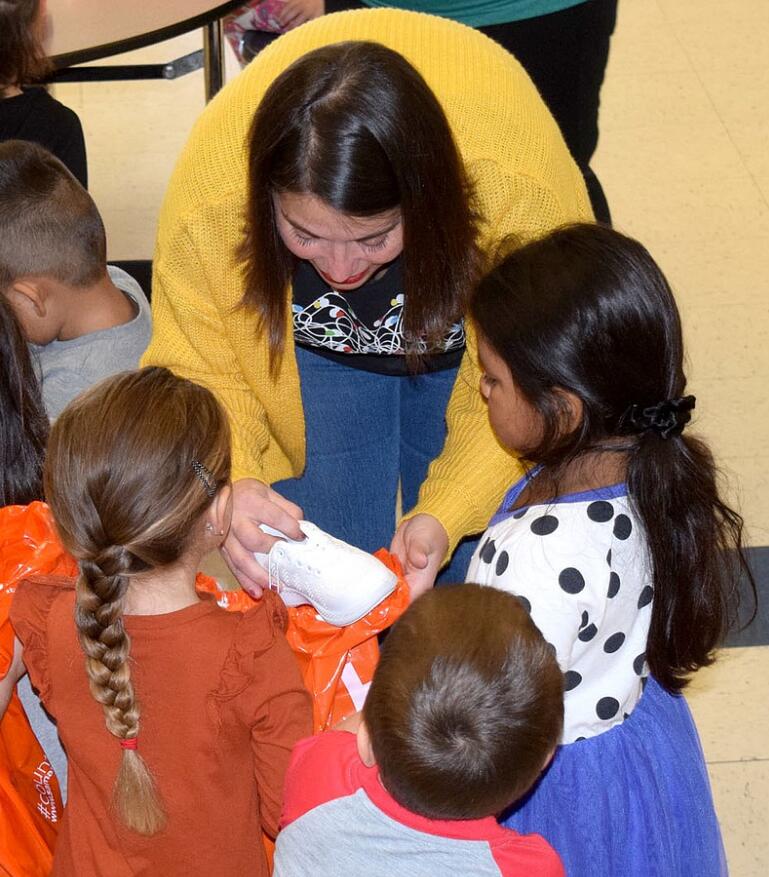 Decatur students receive gifts of shoes for Christmas