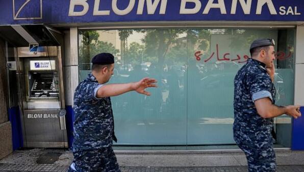 Woman with toy gun grabs trapped savings from Beirut bank