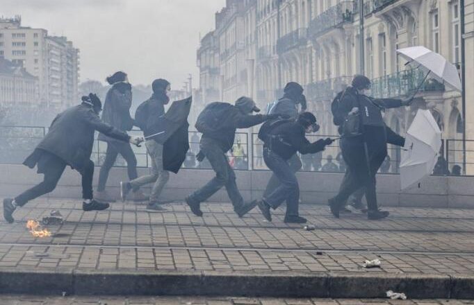 Protesters fill French streets as anger at President Emmanuel Macron mounts