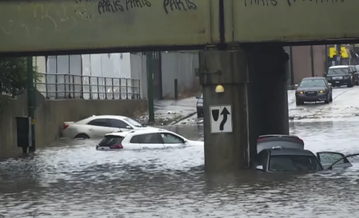 Heavy rains flood Chicago roads and force NASCAR to cut short a downtown street race