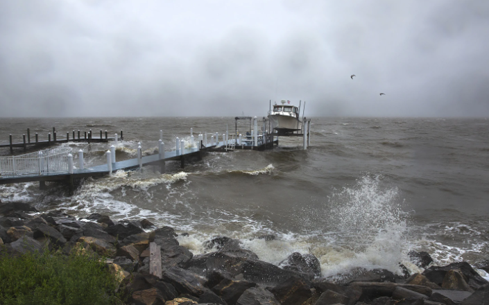 Weakening Ophelia still poses a risk of coastal flooding and heavy rain in some parts of the US