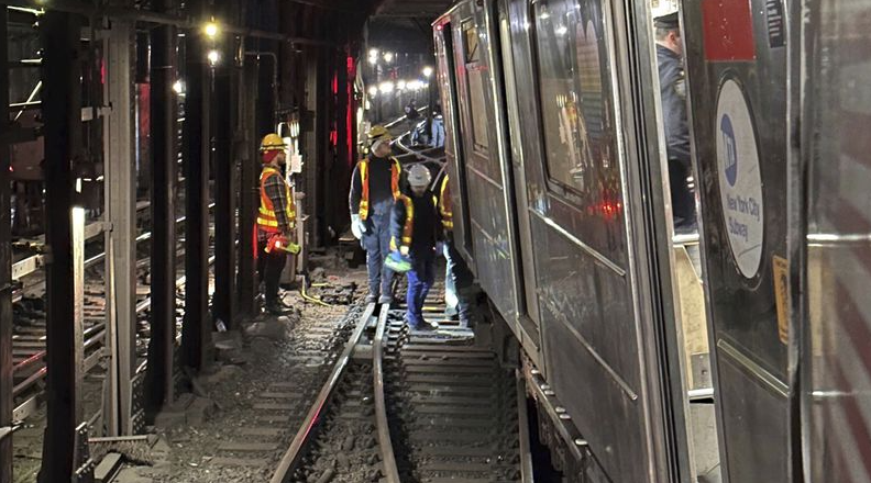 New York City subway train derails in collision with another train, injuring more than 20 people