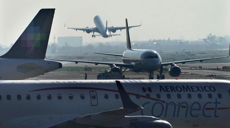 Passengers support man who opened emergency exit and walked on plane’s wing