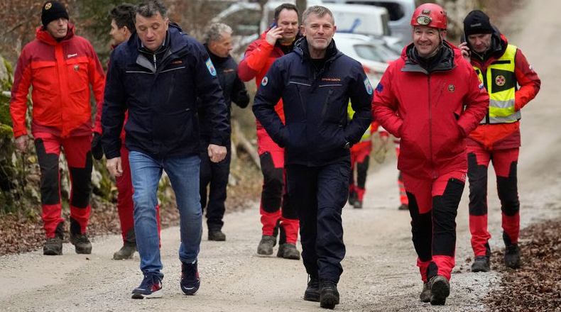 Rescuers bring out five people trapped in Slovenian cave by high waters