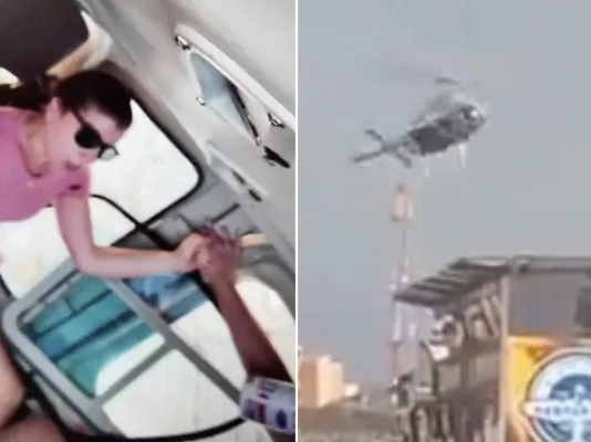 Helicopter carrying tourists spins out of control and crashes into building